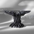 Modern round dining table Cassia with black wood base and crystal top