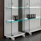 Wall Showcase in Glass and White Wood, Wheels and Illuminated Shelves - Armilla Viadurini
